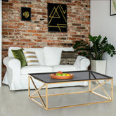 Table basse en verre fumé et pieds or Amelini