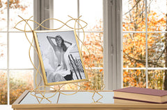 Cadre photo en métal doré design sinueux