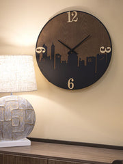 Horloge murale ronde métal et bois décorée ligne d'horizon