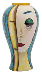 Vase en céramique décor visage avec décorations dorées