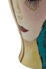 Vase en céramique décor visage avec décorations dorées