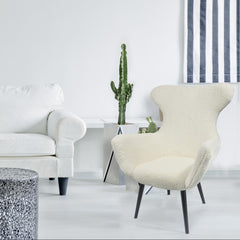 Fauteuil à oreilles en tissu effet peau de mouton couleur crème
